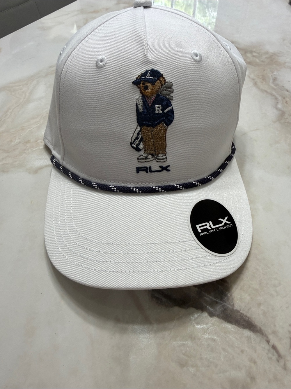 RLX Ralph Lauren White Baseball Cap with Navy Trim and Embroidered Bear